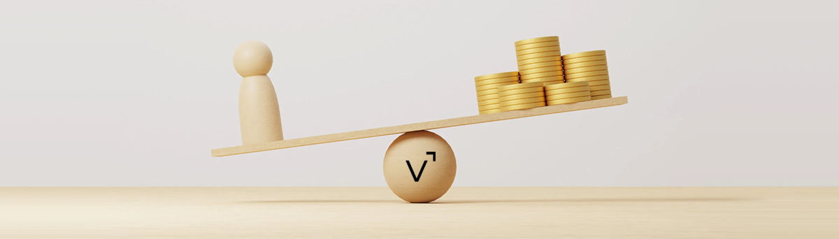 Wooden balance scale with peg figure and gold coins, Vyde symbol.