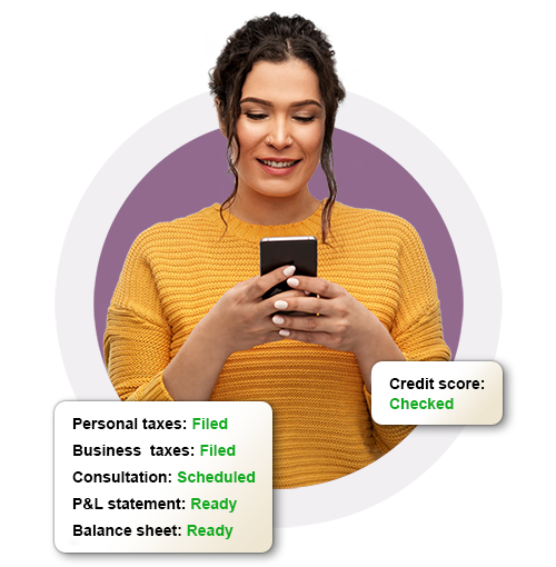 Woman in yellow shirt holding phone with financial task status indicators displayed.
